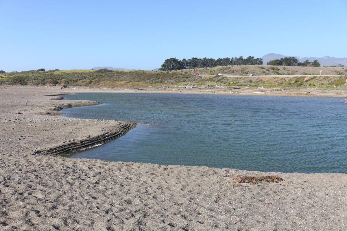 This March 9, 2022, picture shows the mouth of the San Simeon creek, which does not reach the Pacific Ocean. Drought conditions impacting the region mean little precipitation has fallen here over the past few months. When the creek does not reach the ocean, steelhead trout, a species listed as threatened under the federal Endangered Species Act, cannot swim upstream from the ocean to spawn.