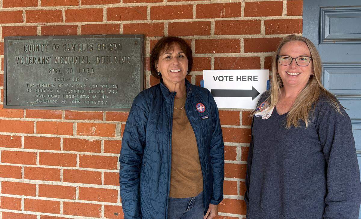 Poll workers Dawn Turner and Kristin Inman wait at the San Luis Obispo Veterans Memorial Building to help voters on Election Day, June 2, 2026.