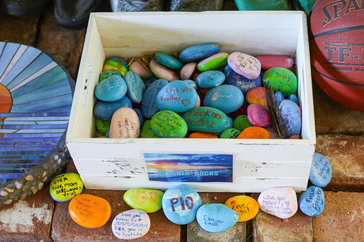 Memorial rocks are part of a memory display for Emilio Velci, an Atascadero teen who died in March 2020 after taking counterfeit Percocet for his wisdom teeth pain. The dealer has been charged with his murder.