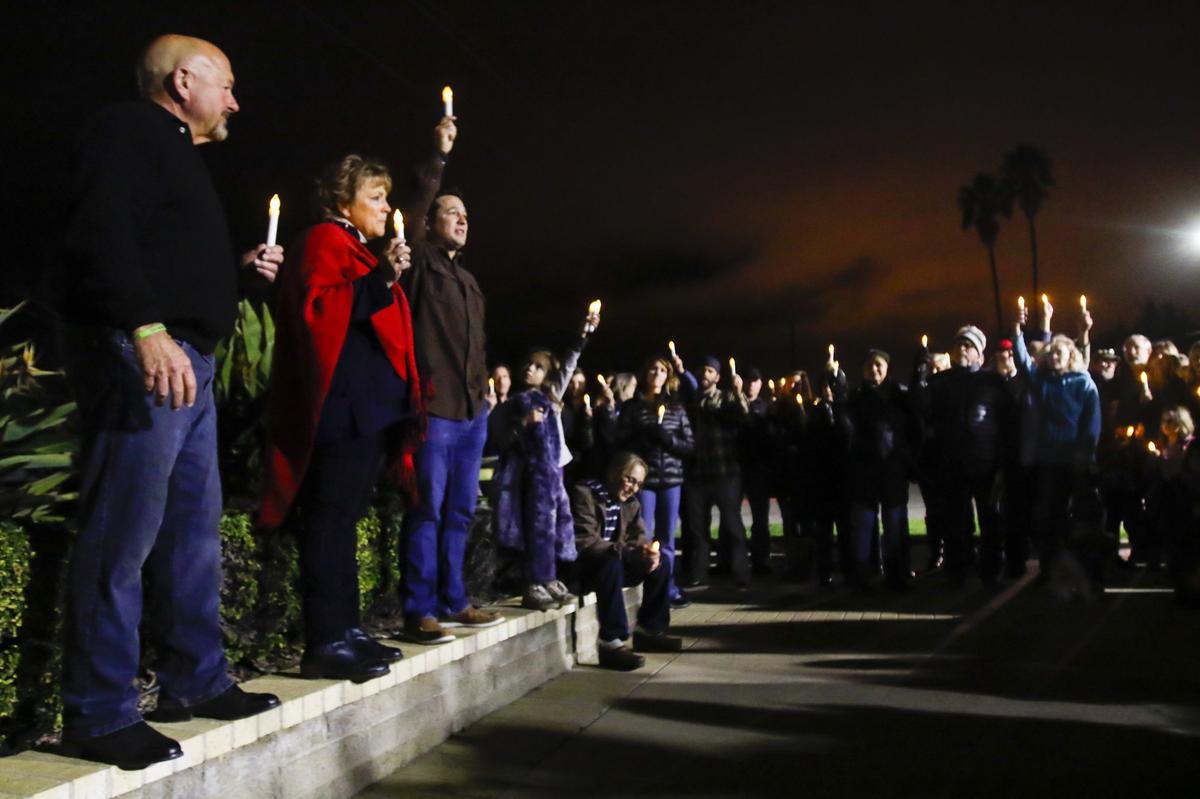 The family of former Atascadero resident Andrew Holland leads a vigil at the SLO County Jail on the first anniversary of Holland’s death. From the left are parents Carty and Sharon and son, Corban, older brother of Andrew. Andrew Holland, 36, died of an embolism Jan. 22, 2017, after being held in a restraint chair for nearly 2 days. About 100 turned out for the vigil and march on Jan. 22.
