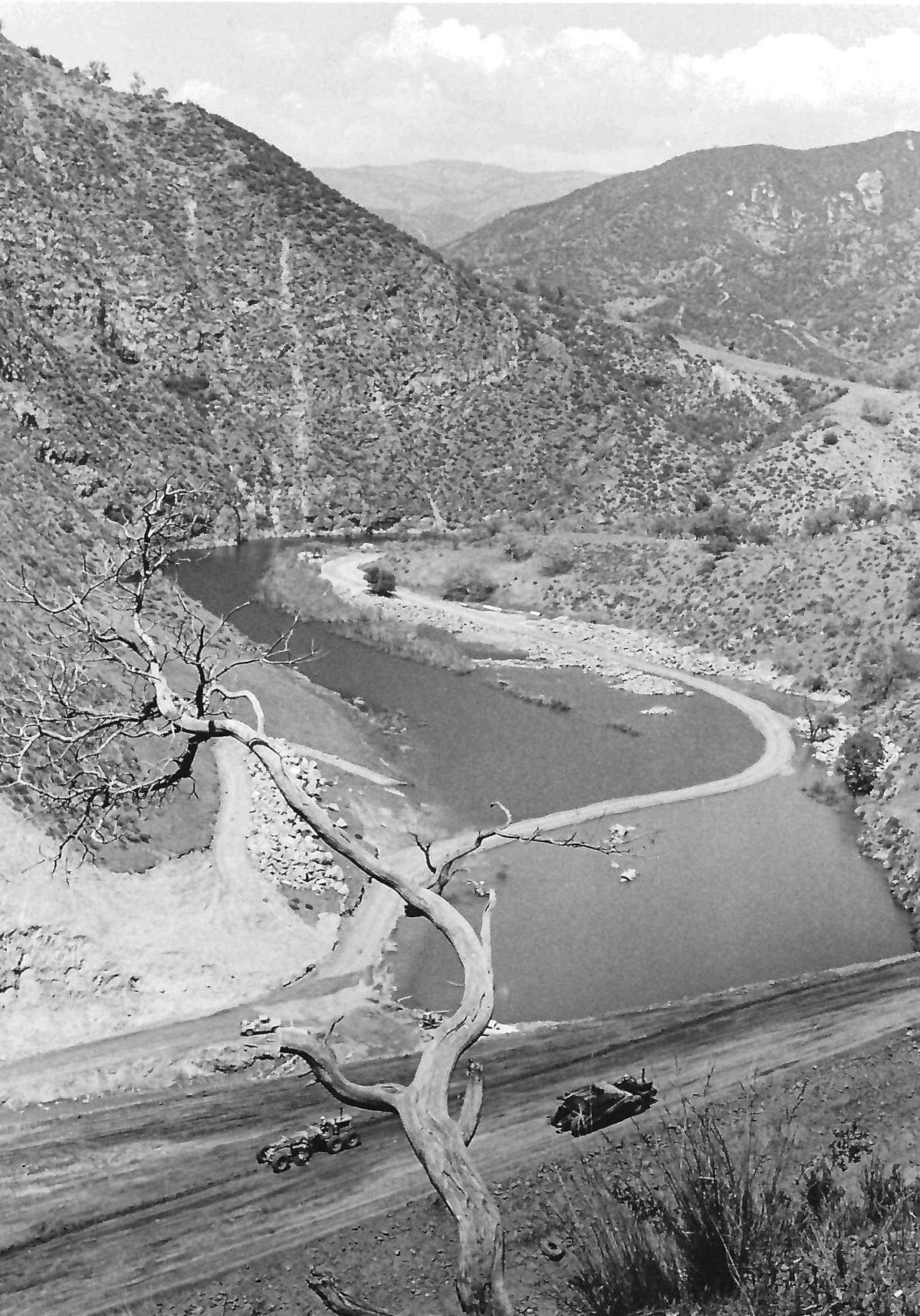 During construction of the new highway, waters of the Cuyama have been impounded behind four temporary dams like this one near Windy Point. Story published May 22, 1971, on the construction of Highway 166.
