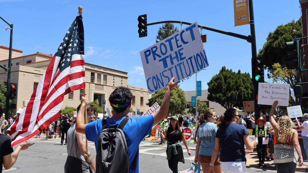 Thousands gathered in San Luis Obispo, California, for No Kings Day to protest executive overreach by the Trump administration on the President’s birthday.