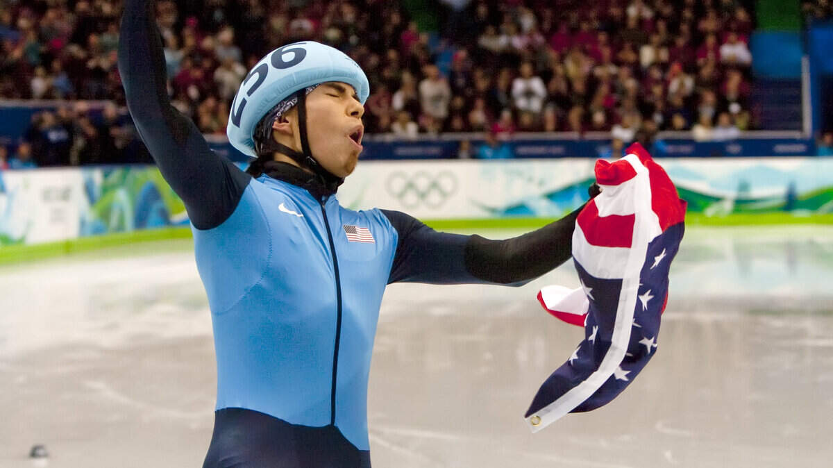 Apolo Anton Ohno celebrates winning silver in the 1,500-meter short track. (George Bridges / MCT)