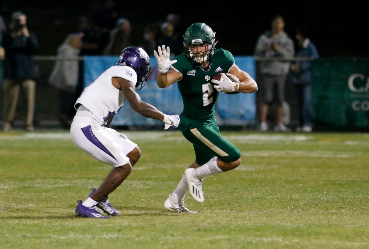 Cal Poly’s Giancarlo Woods (2) attempts to evade Weber State’s Marque Collins (2). Cal Poly lost 38-7 to Weber State at Alex G. Spanos Stadium, on Saturday, Oct. 2, 2021.