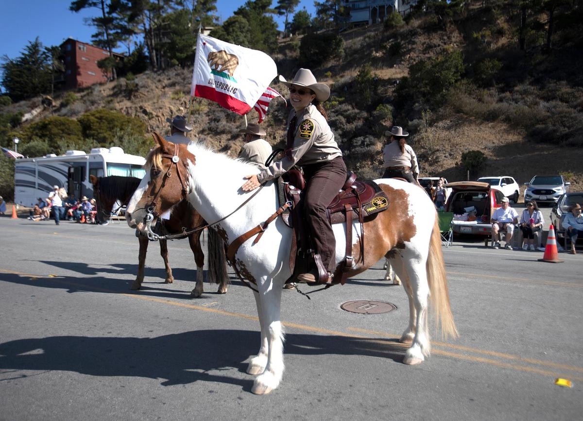 The San Luis Obispo County sheriff’s horse posse paraded down Main Street for the Pinedorado Parade in Cambria, held Sept. 3, 2022.