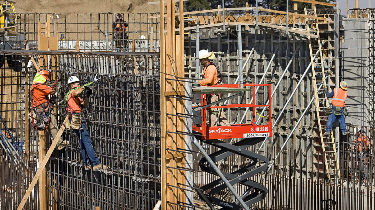 Workers install rebar and concrete forms as work continues at the Los Osos sewage treatment plant Tuesday, Oct. 7, 2014.