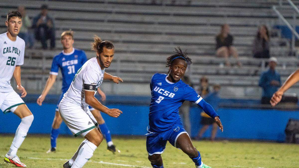 Cal Poly’s Emmanuel Perez (18) defends a UC Santa Barbara player. The Mustangs fell to the Guachos 2-0 in a Blue-Green rivalry game on Sept. 25 at Harder Stadium.