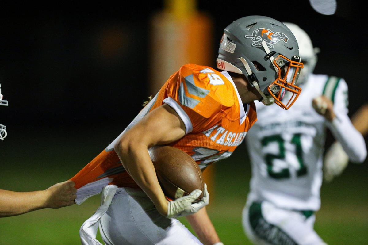 CJ Bell is slowed by a shirt tackle. The Atascadero Greyhounds beat the Templeton Eagles 27-21. Atascadero high School hosted Templeton in Ocean League football on Oct. 7, 2022.