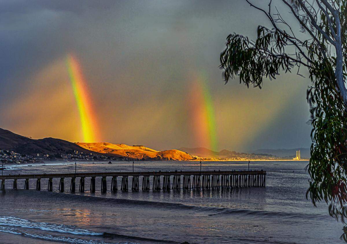 A double rainbow is seen near the Cayucos Pier on Sept. 10.