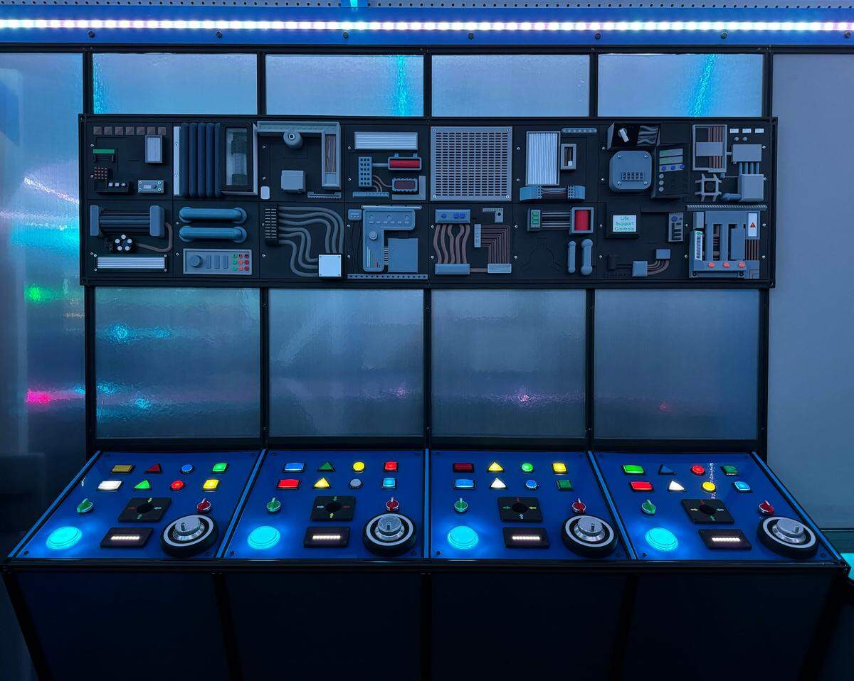 A new escape room, “Renegade: The Retrofit,” has around 200 buttons players can press and nearly 10,000 mulit-colored LED lights, as well as secret doors that pop open and several television monitors.