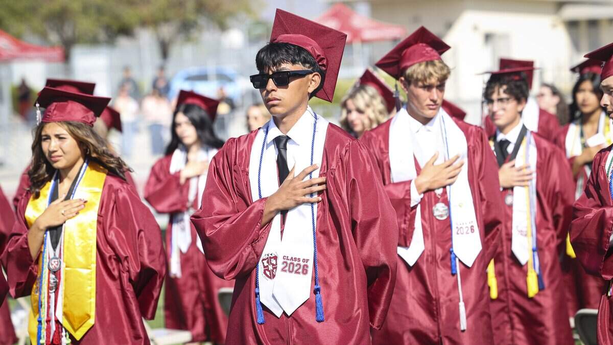Students stand for the National Anthem. Nipomo High School issued diplomas to 198 graduates on June 5, 2026.