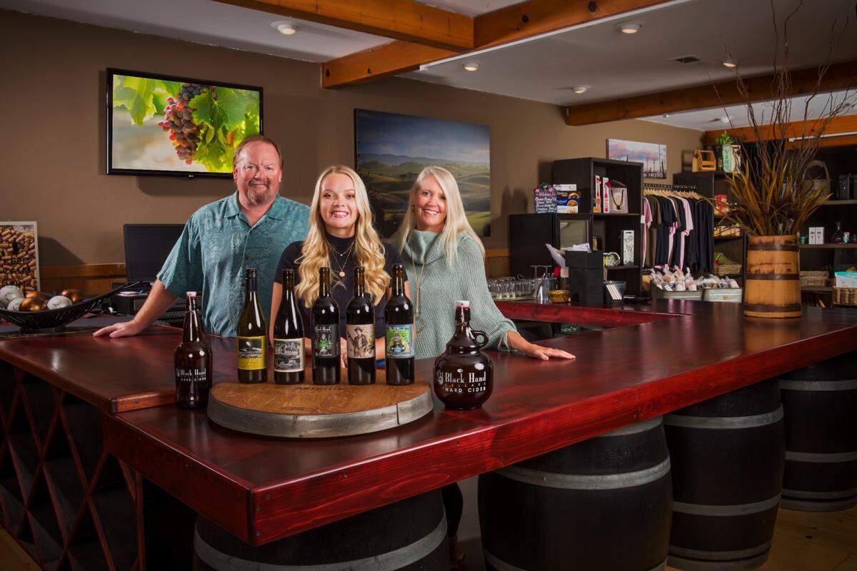 Tom, Cassidie and Terrie Banish showcase the wine and spirits of Black Hand Cellars.