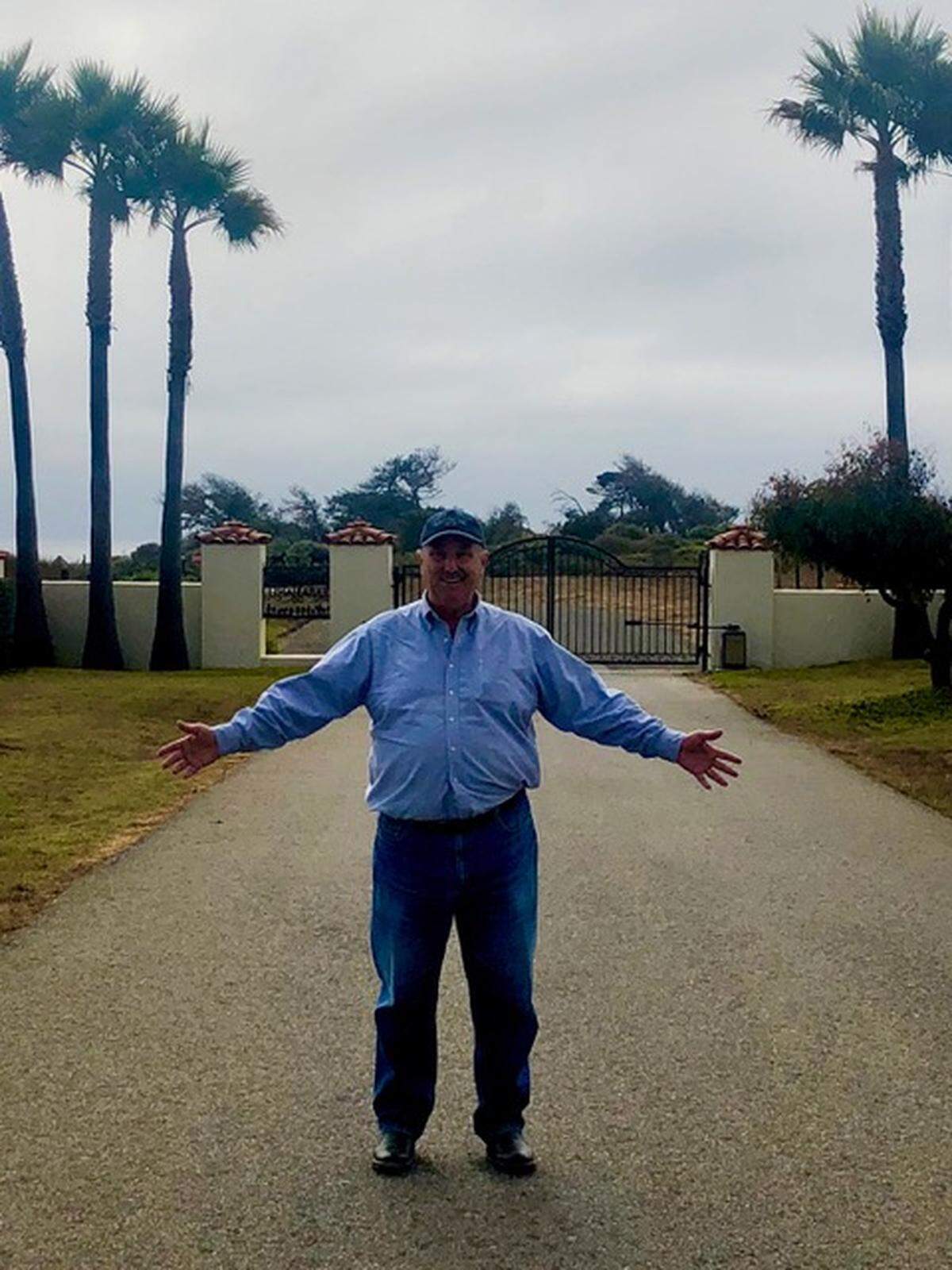 William Randolph Hearst III poses in front of the gate to the family’s Piedra Blanca ranch in San Simeon.