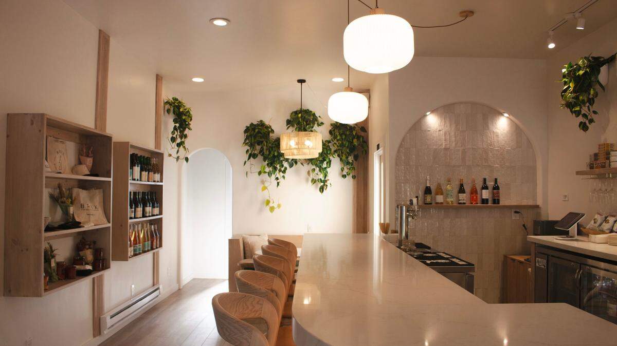 The interior of Brix Wine Bar and Bottle Shop offers a beachy, cozy atmosphere.
