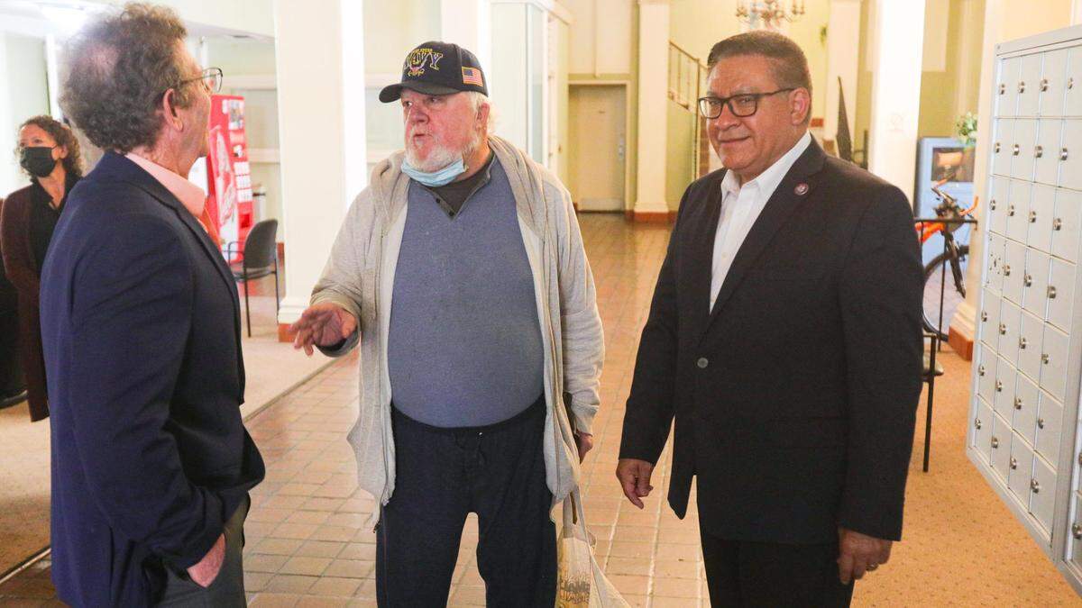 From left, HASLO executive director Scott Smith, Don Weslh, a 12-year resident of the Anderson Hotel, and Congressman Salud Carbajal, explained how securing funding for the Anderson Hotel will help preserve housing for-fixed income residents, during Carbajal’s visit on April 22, 2022.