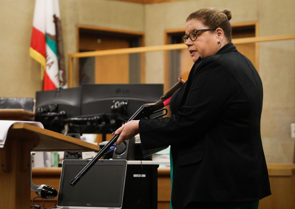 Defense attorney Melina Benninghoff holds a BB gun as she makes her opening statement during the trial of Alex Geiger, a former Grover Beach police officer whose two dogs escaped their enclosure in December 2016 and mauled two neighbors, killing one.