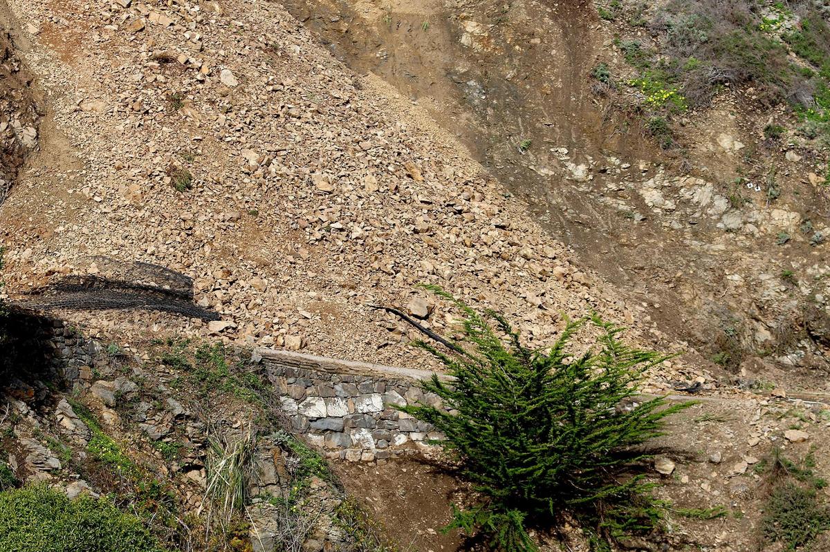 Mesh was unable to contain a rock slide that slipped onto Highway 1 at Polar Star, about a mile south of Ragged Point, seen here on Jan. 5, 2023.