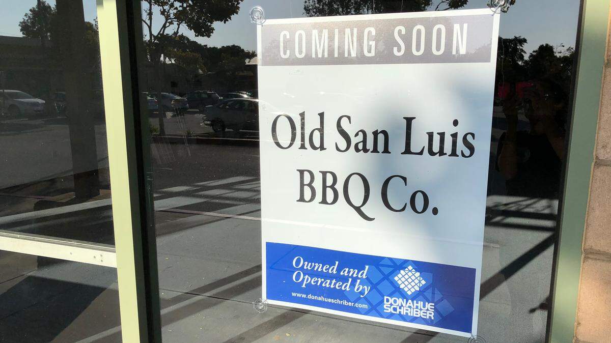 A sign in the window at the Marigold Shopping Center on Broad Street announces Old San Luis BBQ Co. will be coming into the space formerly occupied by The Dollar Store.