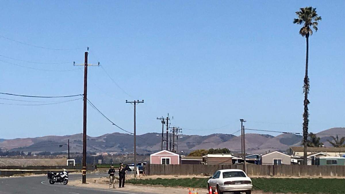 Santa Maria police personnel use a drone to capture photos of the area where a 61-year-old man was found dead in a vehicle on Saturday, April 23, 2022.