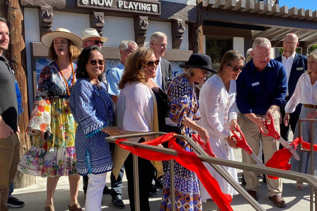 Solvang Theaterfest board chairwoman Denise de Bellefeuille helps cut the ribbon on the newly remodeled theater on Tuesday, July 12, 2022, along with board members and capital campaign co-chairs Ann Foxworthy Lewellen and Chris Nielsen.