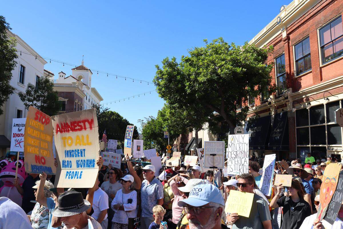 Thousands of people attended the No Kings rally in downtown San Luis Obispo to protest the Trump administration and support Prop. 50 on Oct. 18, 2025.