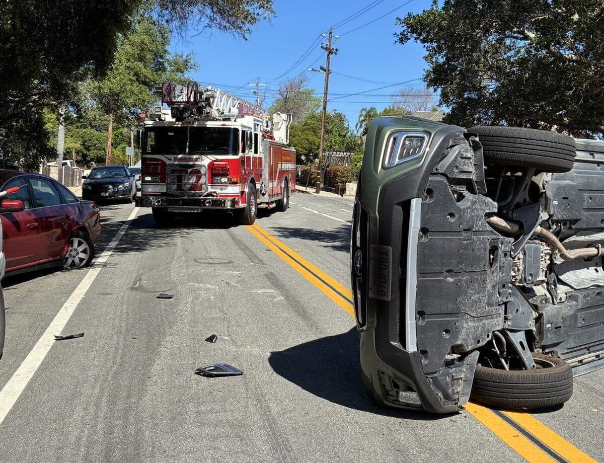 A car flipped on its side after ramming into a parked car at Chorro Street and West Street in San Luis Obispo on March 20, 2026.