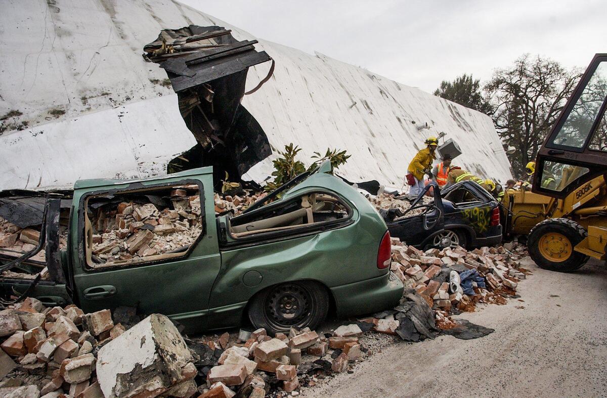 Cars were crushed and two people died on Pine Street in Paso Robles when an unrienforced masonry building collapsed during the San Simeon Earthquake, Dec. 22, 2003.