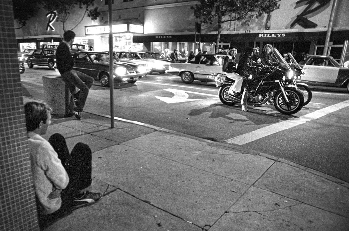 Spectators watch the parade of cars during the last cruise night in San Luis Obispo, July 3, 1980 at the corner of Higuera and Chorro Streets.