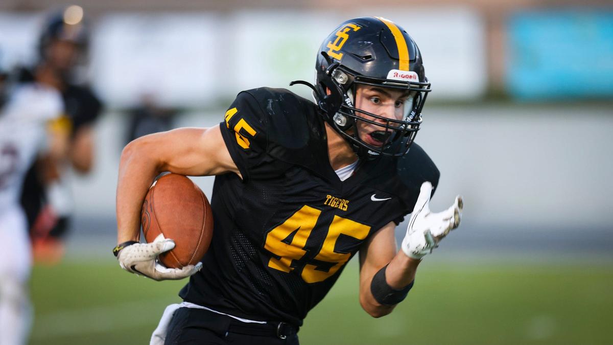 Golbin Garrison runs for the Tigers. San Luis Obispo High School won 34-23 over Mount Whitney, of Visalia Aug. 23, 2024.