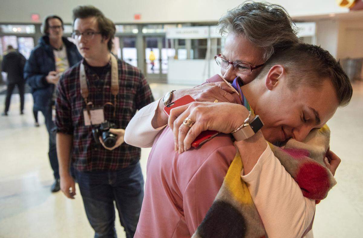 JJ Warren of New York embraces Julie Arms Meeks of Atlanta during protests outside the United Methodist Church’s 2019 Special Session of the General Conference in St. Louis, Mo., Tuesday, Feb. 26, 2019. The United Methodist Church faces a likely surge in defections and defiance after delegates at a crucial conference voted to strengthen bans on same-sex marriage and ordination of LGBTQ clergy.
