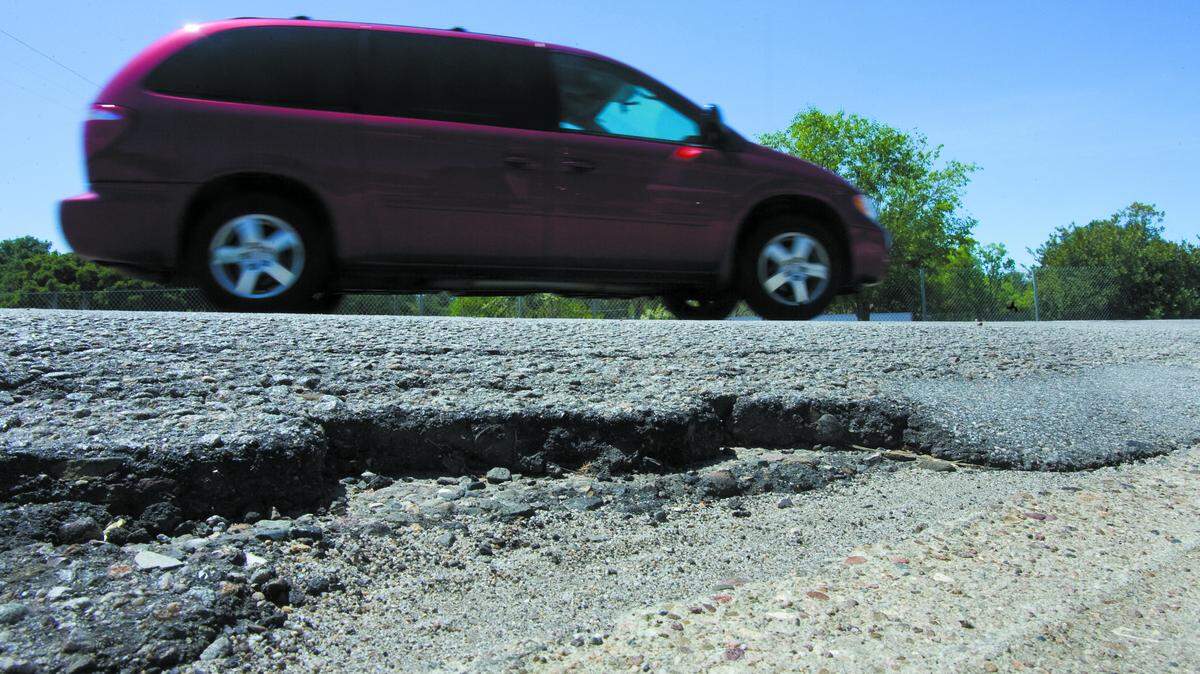 Increasing Atascadero's sales tax would help upgrade roads, described as the city's "biggest challenge," city leaders say. Shown here is pavement damage on East Front Street.