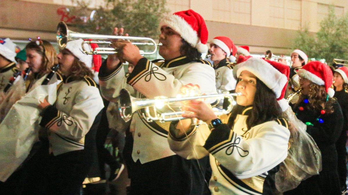 San Luis Obispo High School Marching Band performs at a holiday parade.