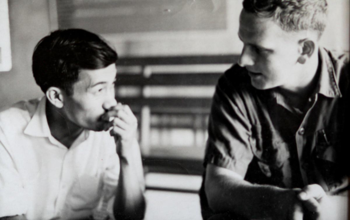 Bruce West, right, San Luis Obispo County resident and author of “Auspicious Journey,” wrote a novel about his time as a civic officer serving in the Vietnam War. Here he speaks with South Vietnamese village resident Ong De, whom he befriended during the war.