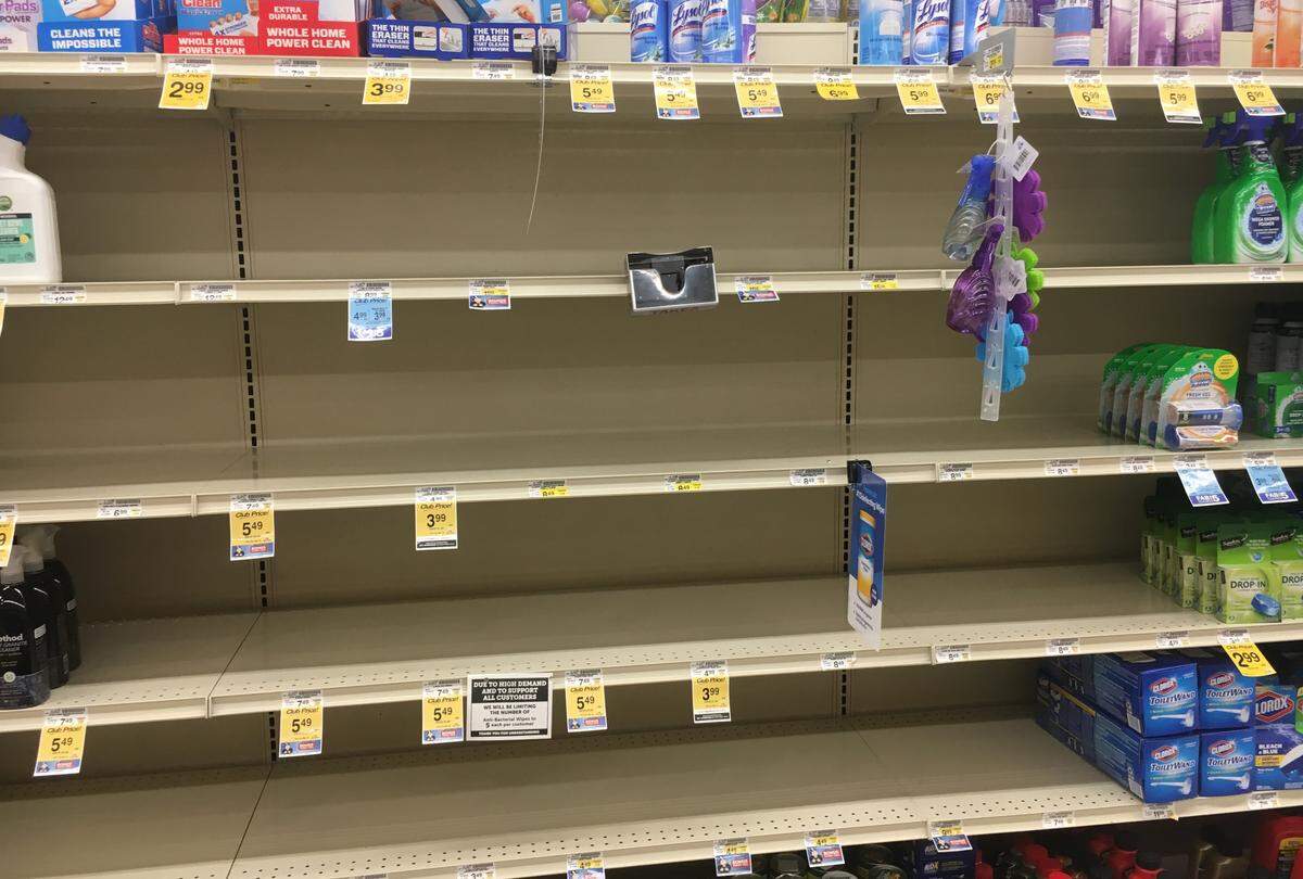 Shelves that would normally hold disinfectant sprays and wipes are bare at Vons grocery store in San Luis Obispo on Monday, March 7, 2020. The store posted a sign limiting sales of packages of disinfectant wipes to five per customer.