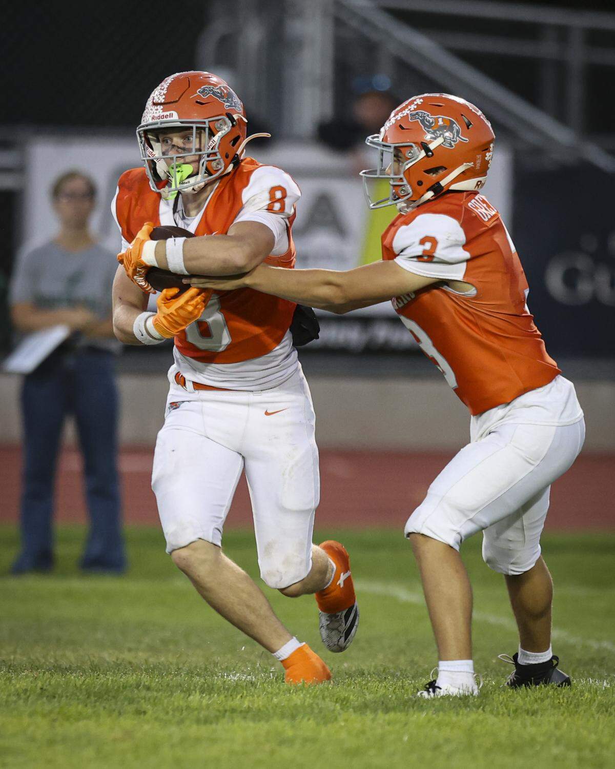 Bishop Resco takes the handoff from Mike Trejo. The Templeton High School football team beat Atascadero 31-20 on Sept. 26, 2025.