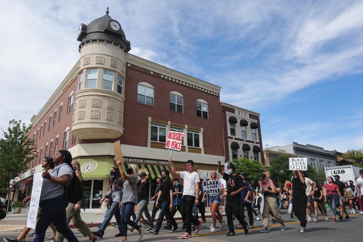 About 100 protesters march in downtown Paso Robles during a Black Lives Matter protest on Tuesday, June 2, 2020. Here, they walk past the Acorn Building on 12th Street.