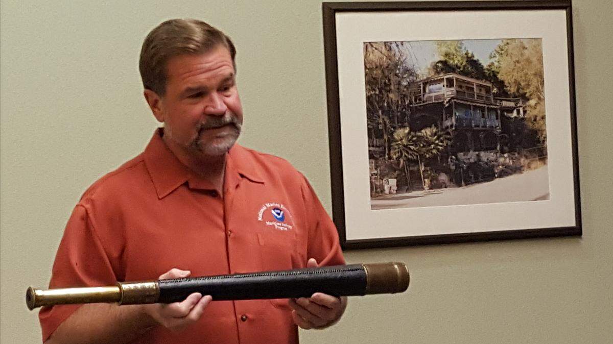 Robert Schwemmer is seen with an artifact from the S.S. Montebello; the only other is an oar on display at the Cambria Historical Society Museum.