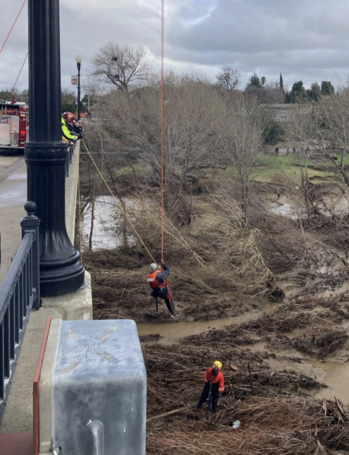 Paso Robles firefighters rescue a man trapped on an island in the Salinas River near the 13th Street Bridge on Friday, Jan. 13, 2023, , utilizing a high-angle rope rescue to pull him to safety.