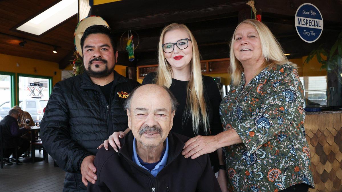 From left, Ernesto Cadena, Jennifer Cadena and Dona Simpson stand for a family portrait on Feb. 3, 2023, while Lalo Cadena sits. Jennifer Cadena is the owner of Maya Mexican restaurant, which moved to 560 Embarcadero in Morro Bay after more than 40 years on Main Street.