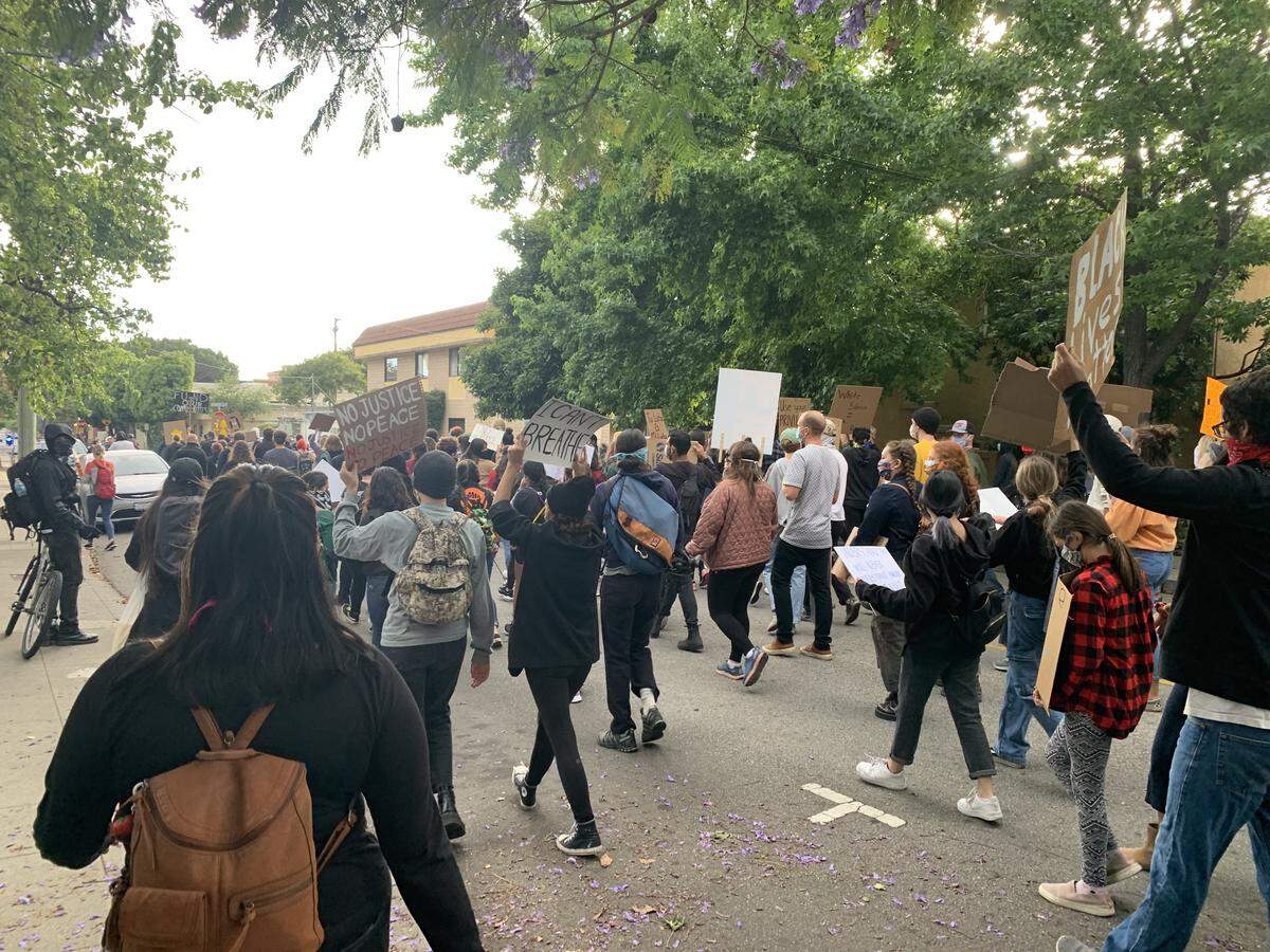 Protesters march on Pacific Street in San Luis Obispo on Friday, June 5, 2020. 