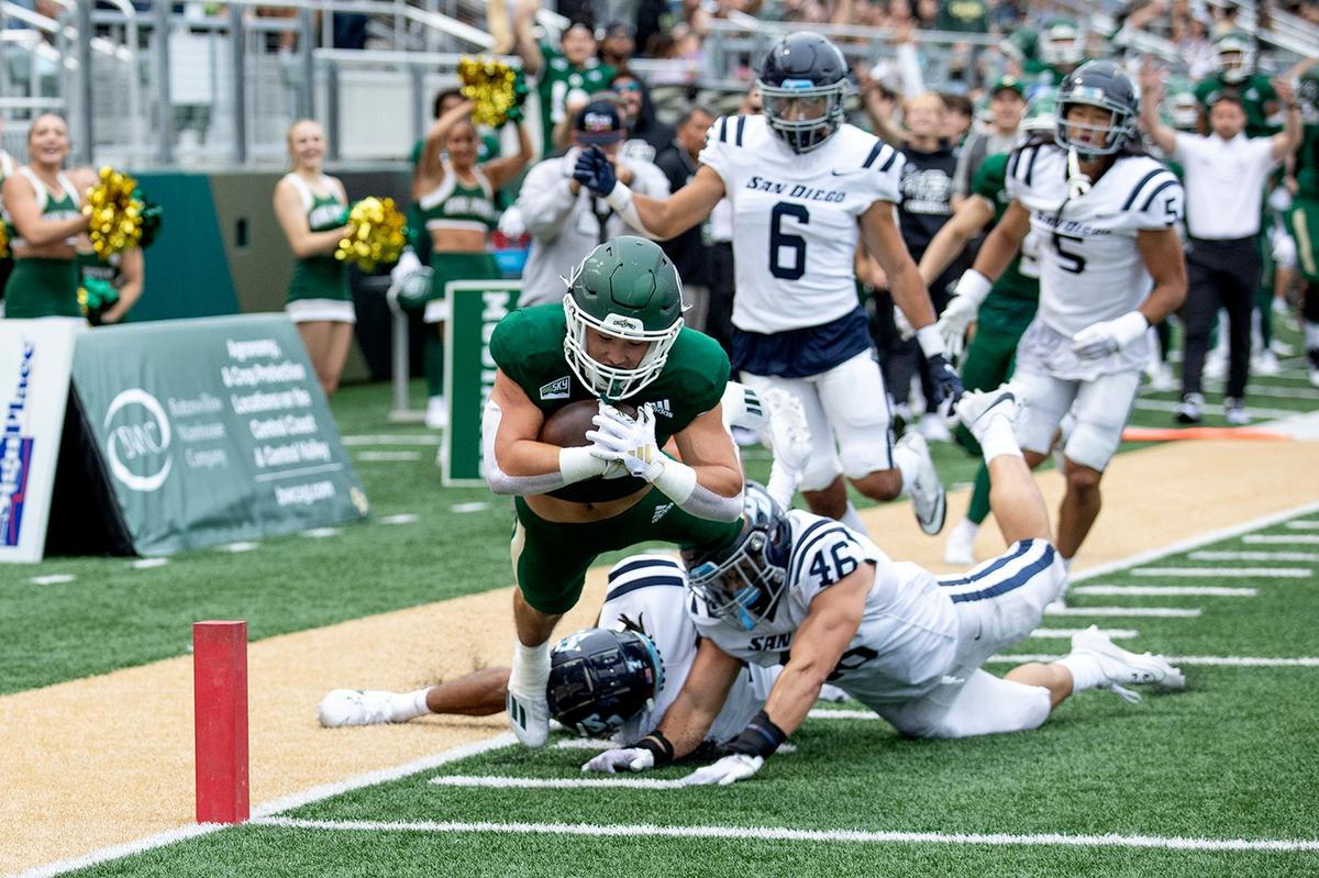 Mustang running back Troy Fletcher dives into the end zone for a touchdown in Cal Poly’s 27-10 win over the University of San Diego at Alex G. Spanos Stadium on Sept. 2, 2023.