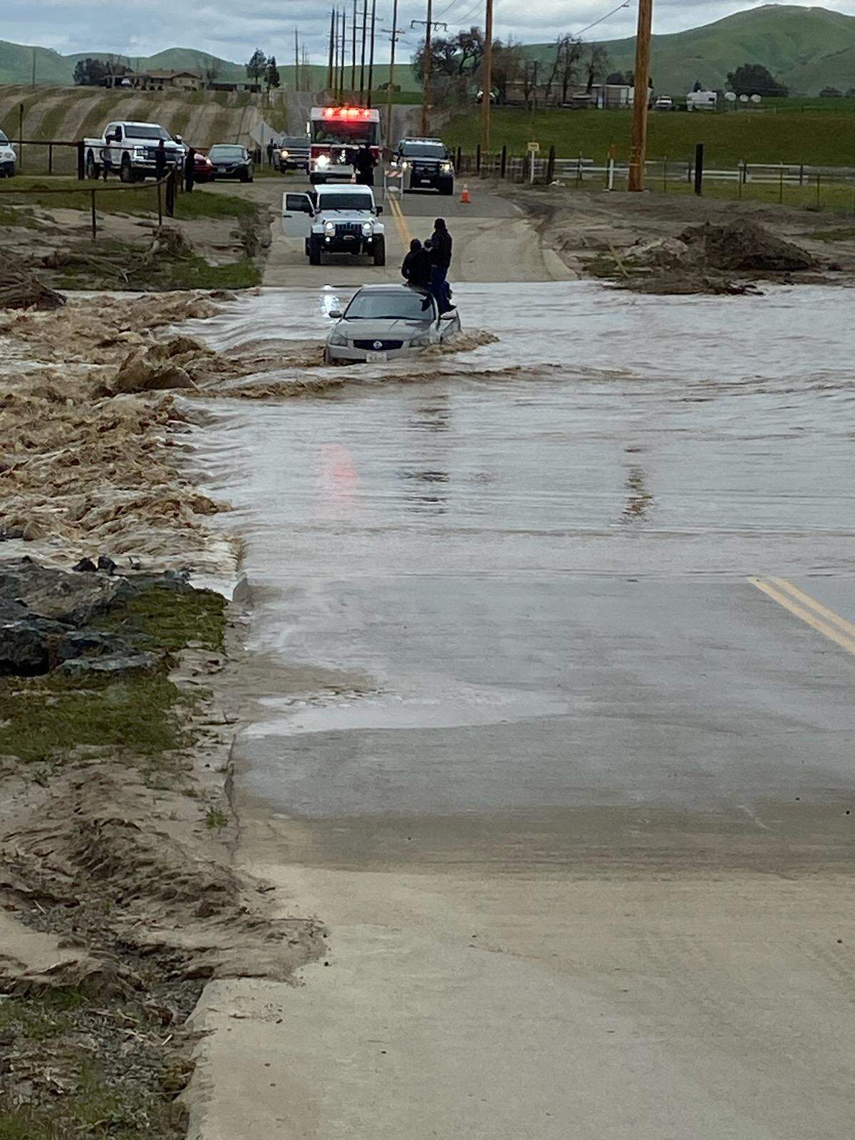 Four people were stranded on the roof of a car in Paso Robles after attempting a low water crossing on Sunday, Feb. 26, 2023.
