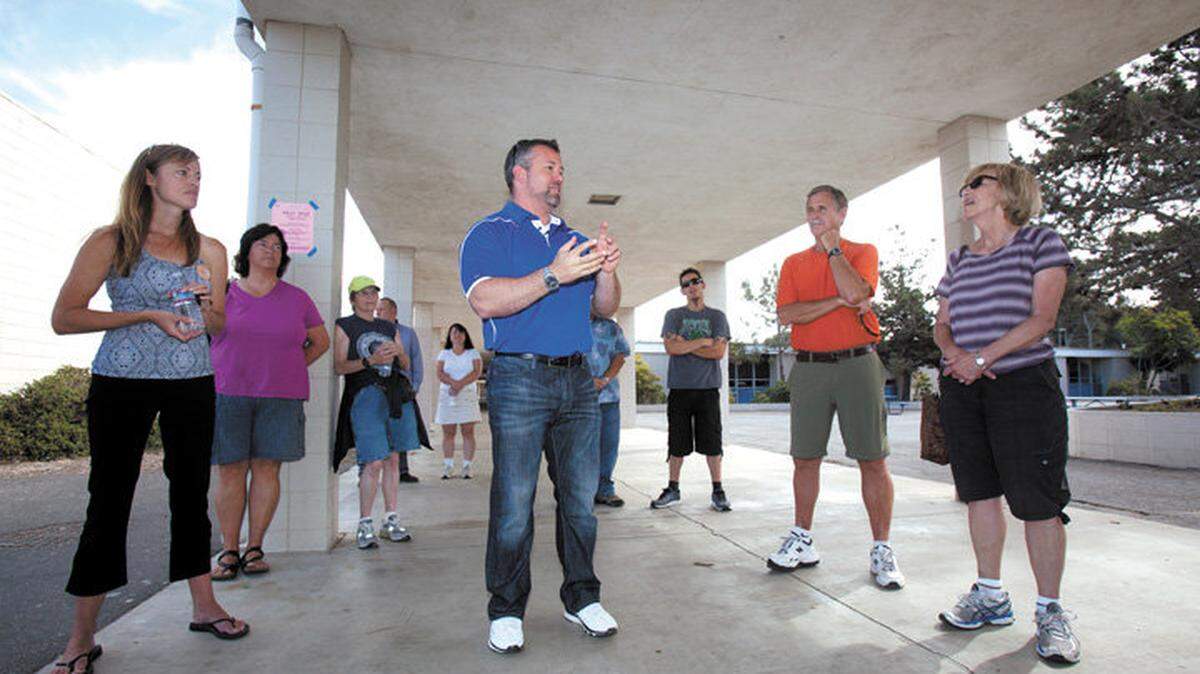 Morro Bay High School Principal Kyle Pruitt and Amy Burton, a Morro Bay leader in supporting Measure D, field questions from a group touring the campus on Oct. 4, 2014.