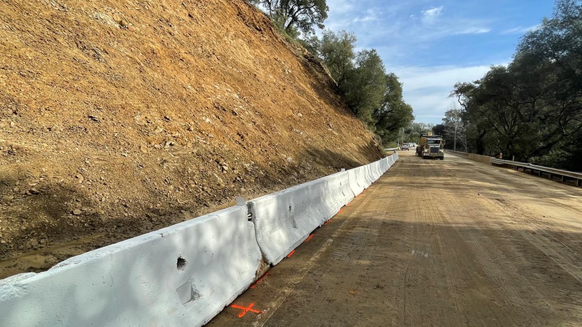 A K-rail is being installed on Highway 41 in Atascadero on Tuesday, March 28, 2023. The rail will allow the highway to reopen after a landslide caused by recent storms closed it for two weeks.