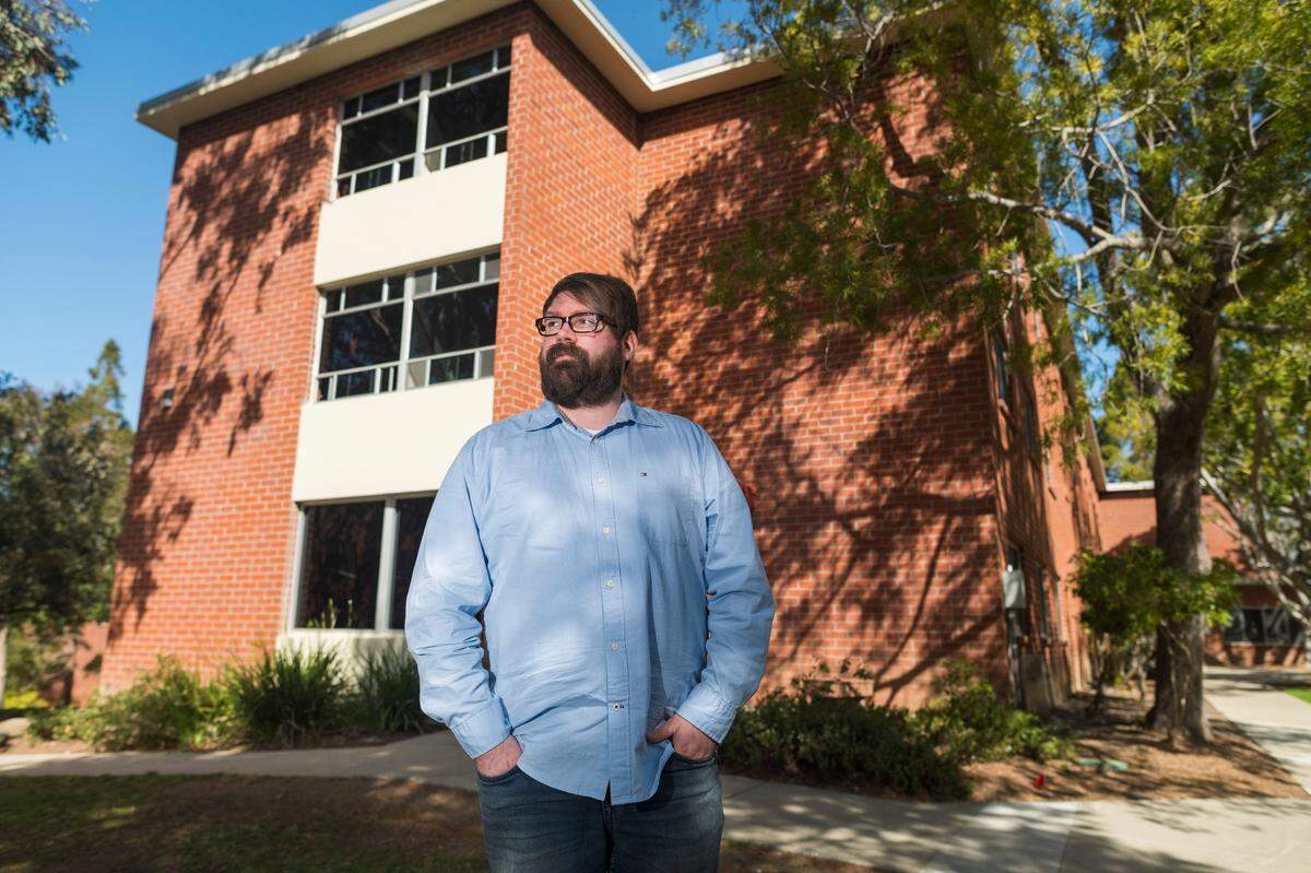 Chris Lambert, an Orcutt musician and recording engineer, poses Thursday, April 15, 2021, in front of Muir Hall dormitory at Cal Poly in San Luis Obispo. Lambert started a podcast to document the 1996 disappearance of Kristin Smart, who was a college student at Cal Poly and lived in Muir Hall when she disappeared.