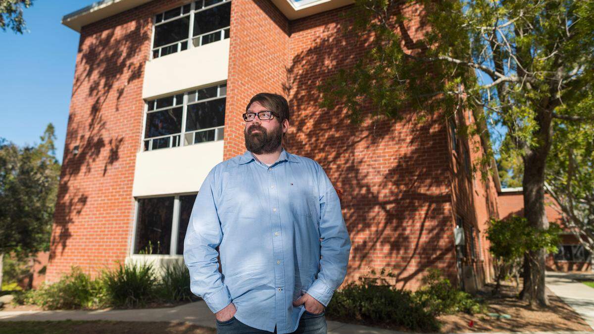 Chris Lambert, an Orcutt musician and recording engineer, poses Thursday, April 15, 2021, in front of Muir Hall dormitory at Cal Poly in San Luis Obispo. Lambert started a podcast to document the 1996 disappearance of Kristin Smart, who was a college student at Cal Poly and lived in Muir Hall when she disappeared.
