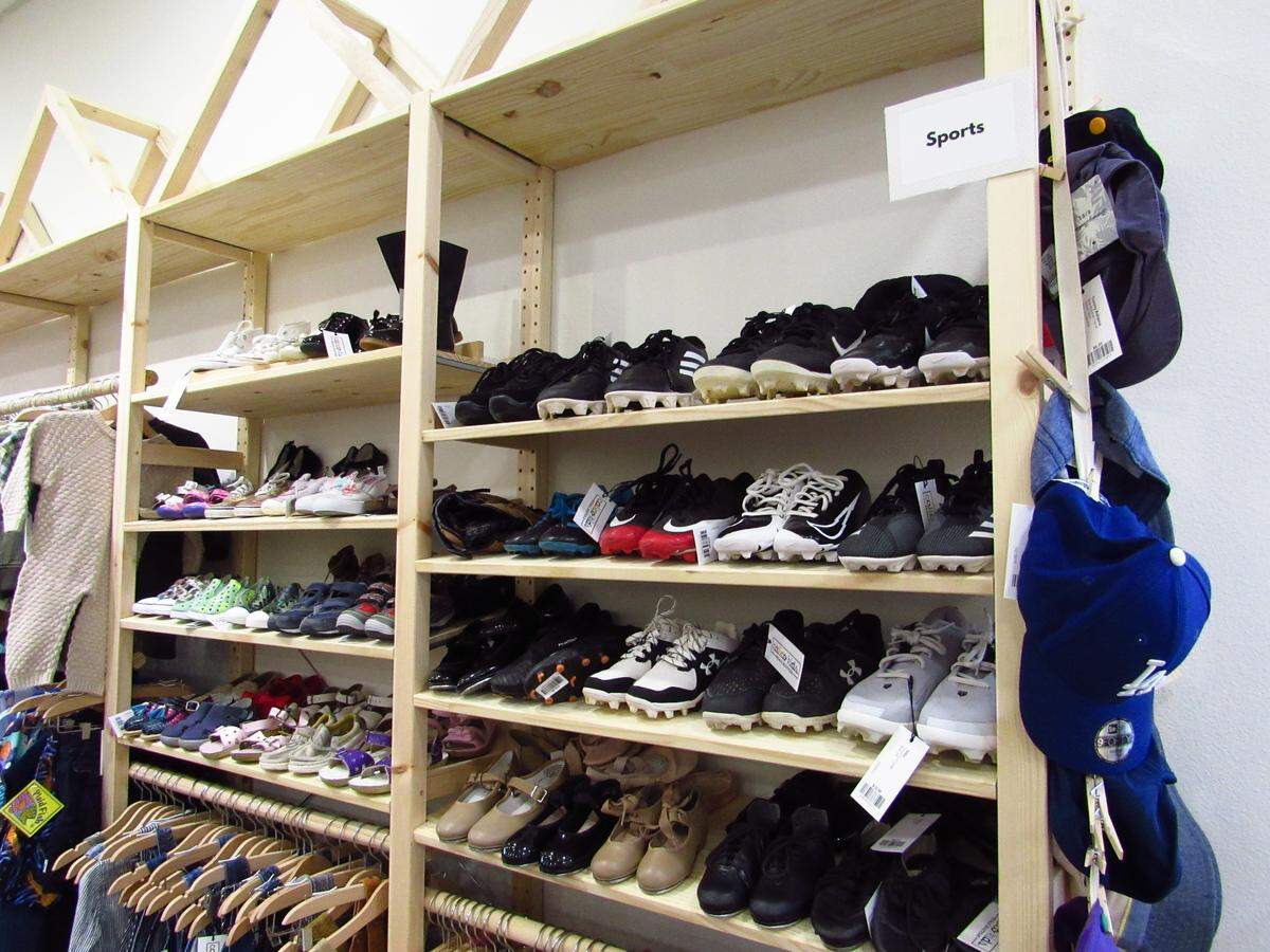 A section in the new kids secondhand store Calico Kids is reserved for sports shoes and attire.