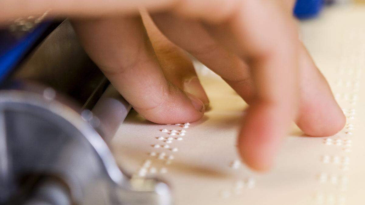 Andy, 7, blind since birth, has been learning Braille since he was 5 years old.