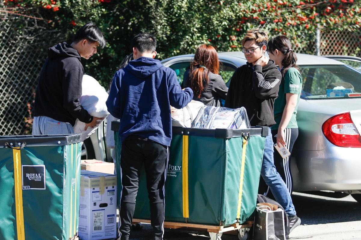 A group of Cal Poly students pack a car with their last belongings in March after being notified that the spring quarter would be conducted online. The university will have a blend of online and in-person classes in the fall.