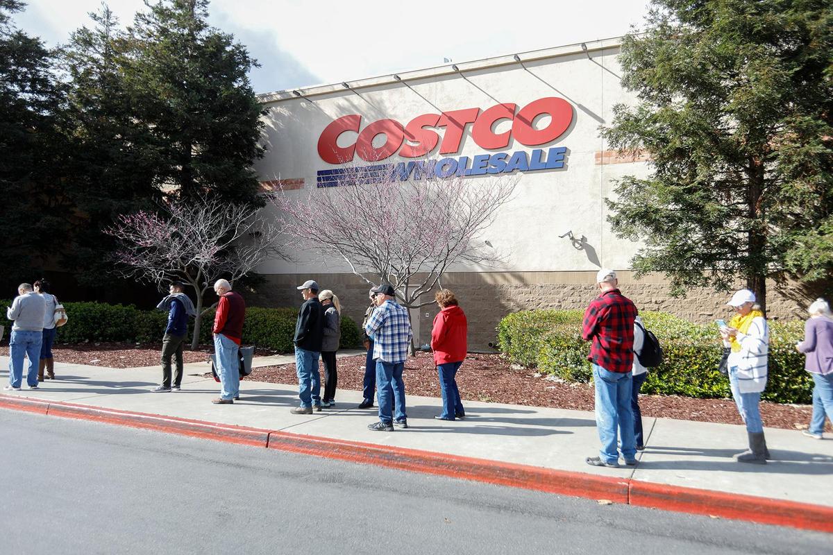 Hundreds of Costco shoppers wait in one long line around the San Luis Obispo store to get in to shop in 2020.